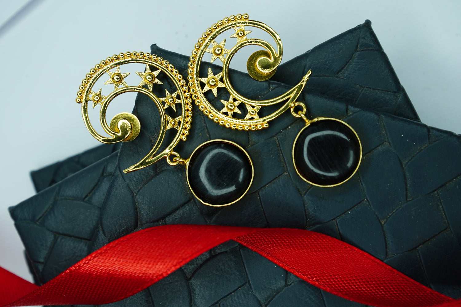Gold Plated Celestial Spiral Earrings with Black Stone Drops