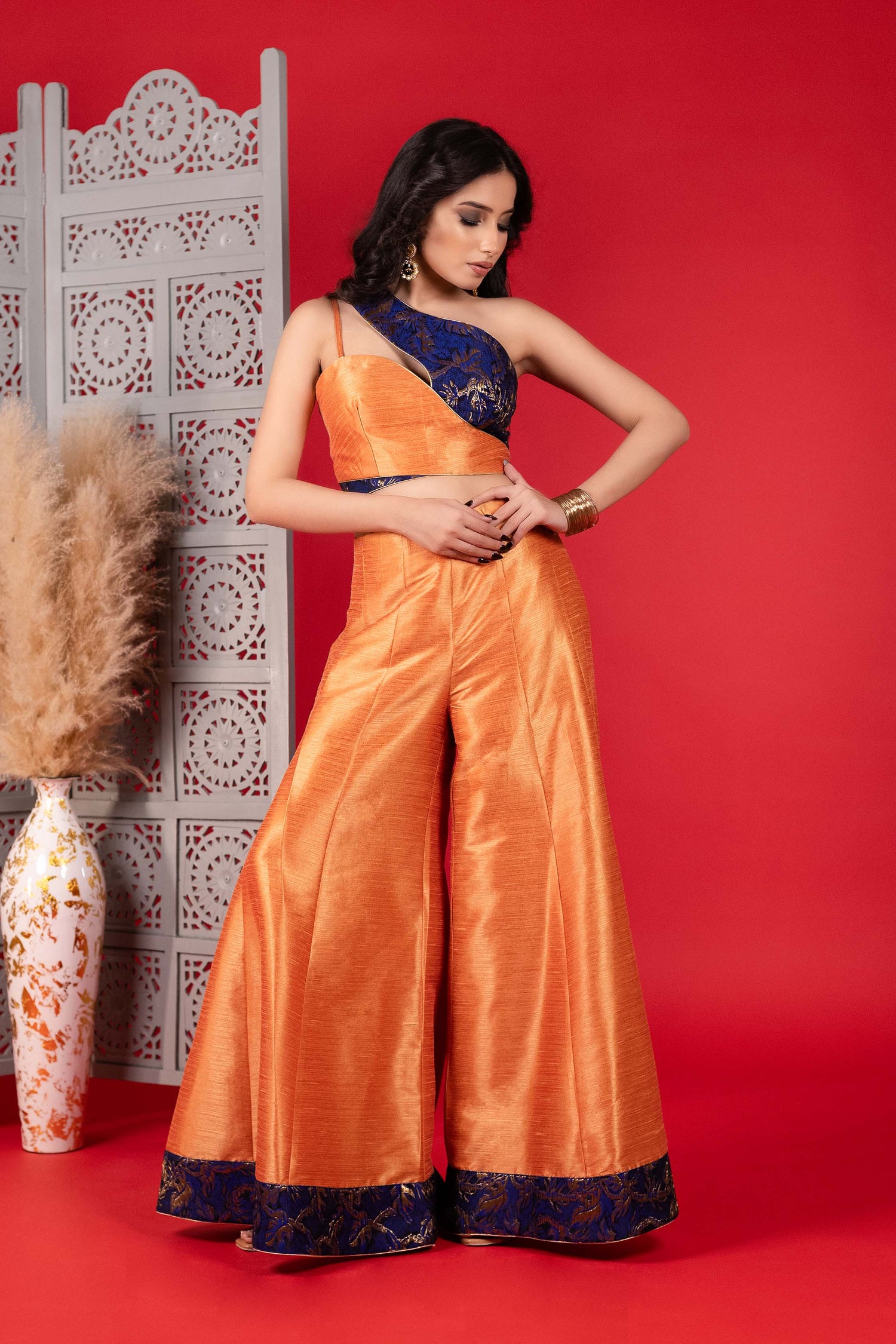Blue Jacquard one shoulder blouse with orange flared pants