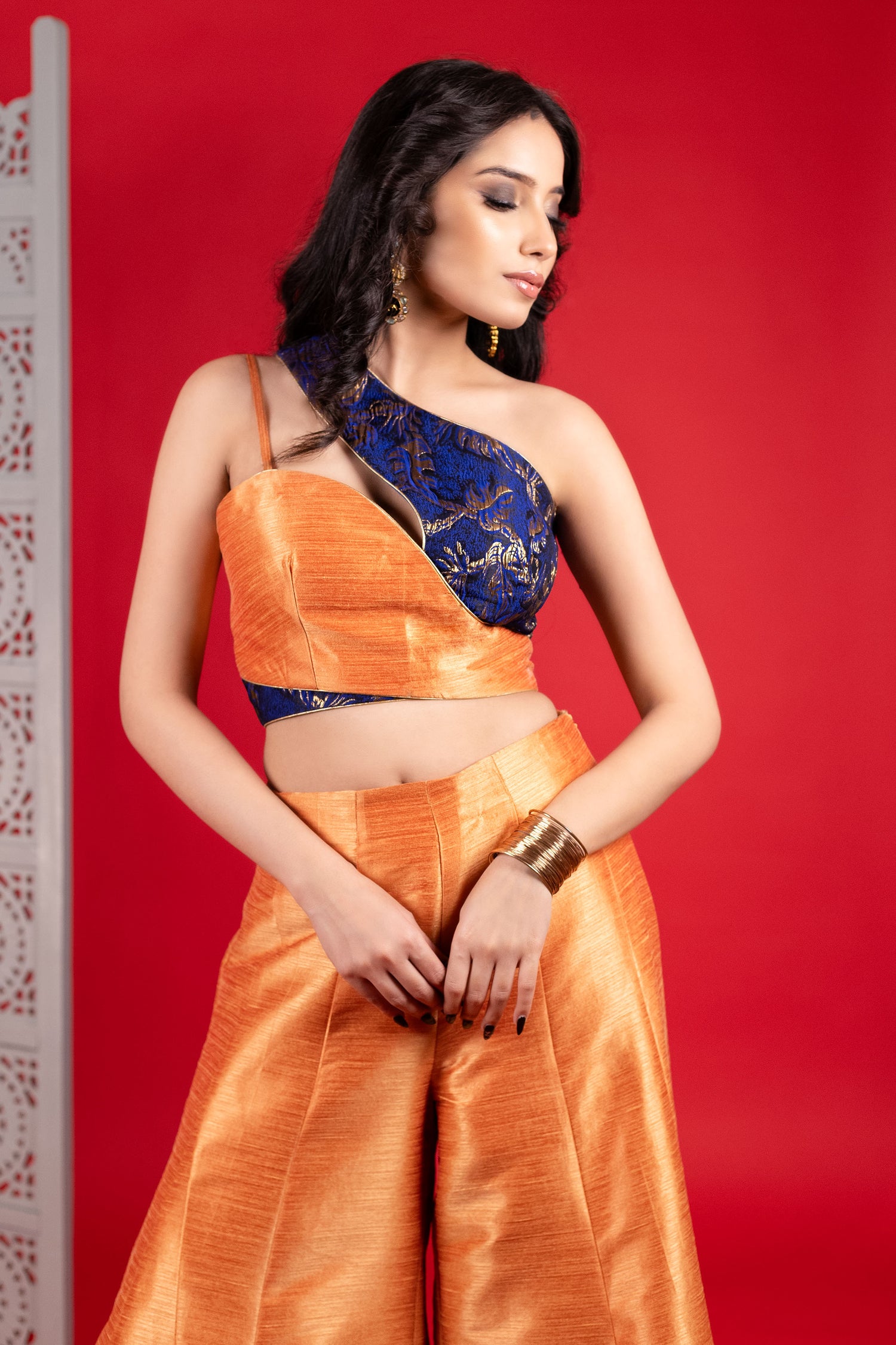 Blue Jacquard one shoulder blouse with orange flared pants