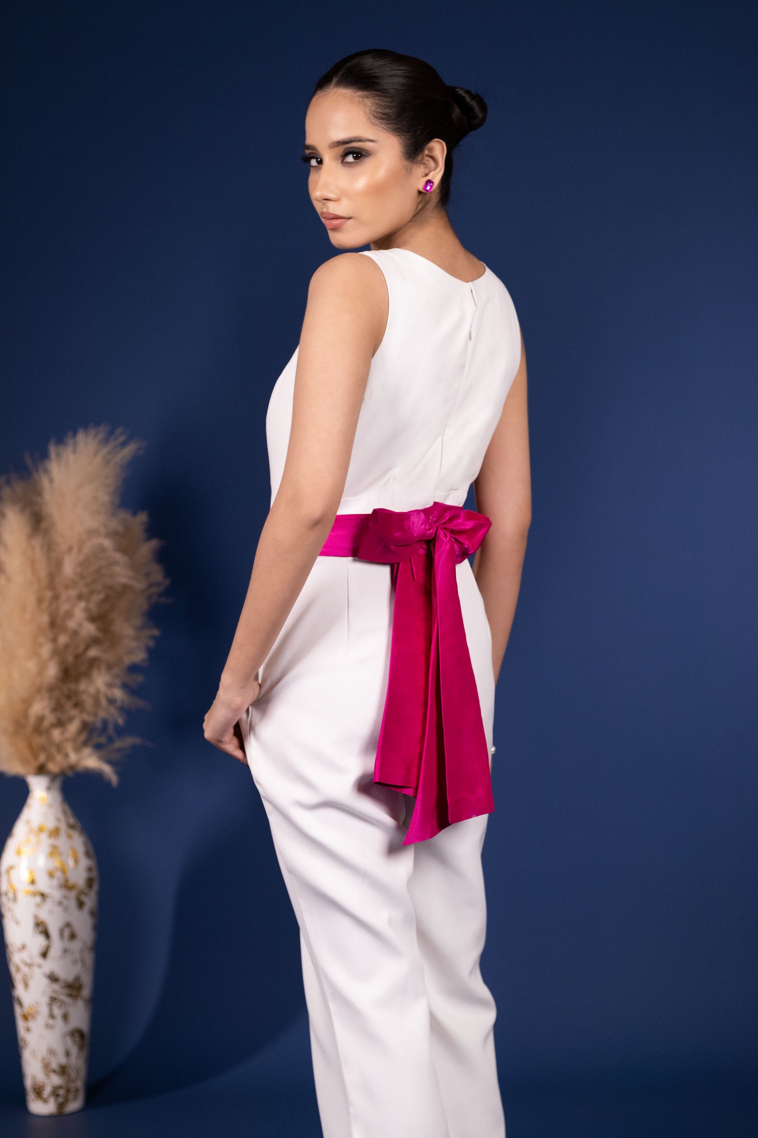 White Jumpsuit with Extravagant Magenta Bow