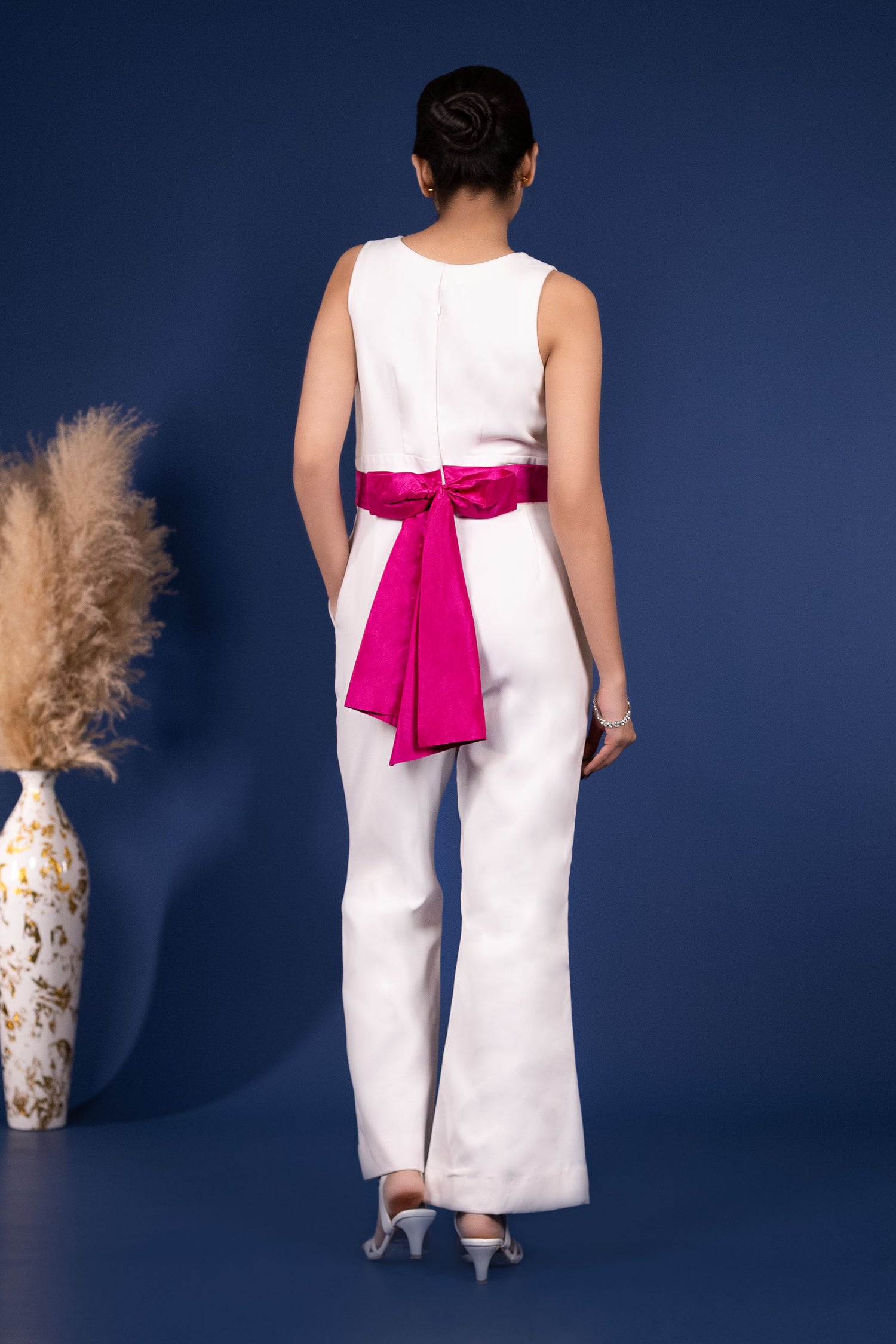 White Jumpsuit with Extravagant Magenta Bow